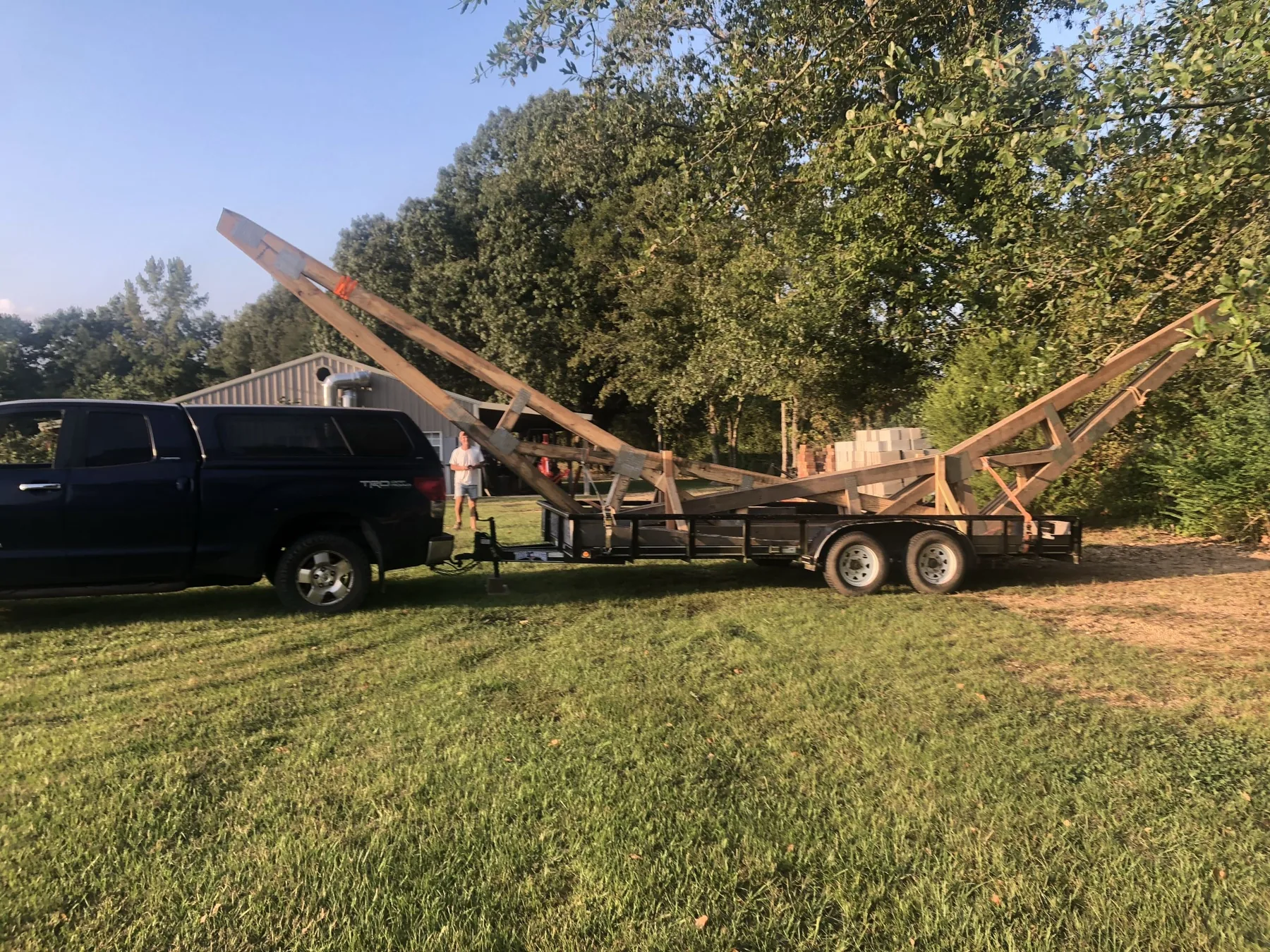 Junk Gone Fast truck and trailer hauling a large removal load in Central Arkansas